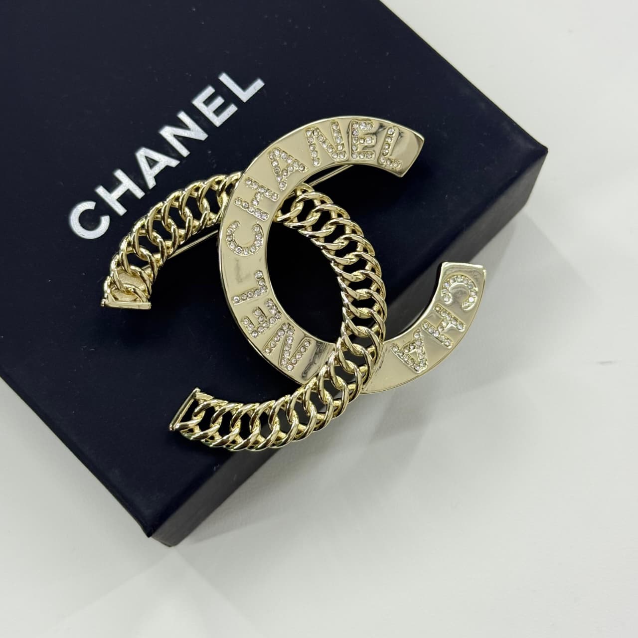 WhatsApp Image 2025-10-01 at 2.13.53 PM Chanel Gold Logo With Chain Detailing Brooch