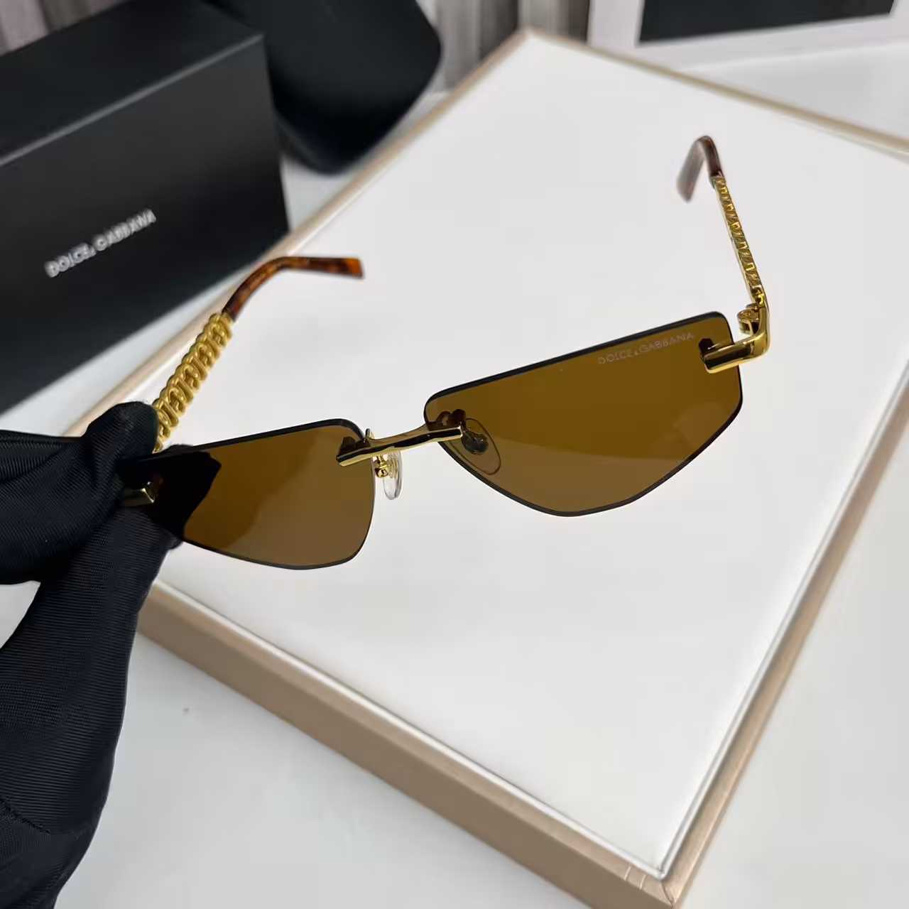 WhatsApp Image 2025-11-13 at 7.00.55 PM (1) Dolce & Gabbana Premium Gold Chain Brown Rimless Sunglasses