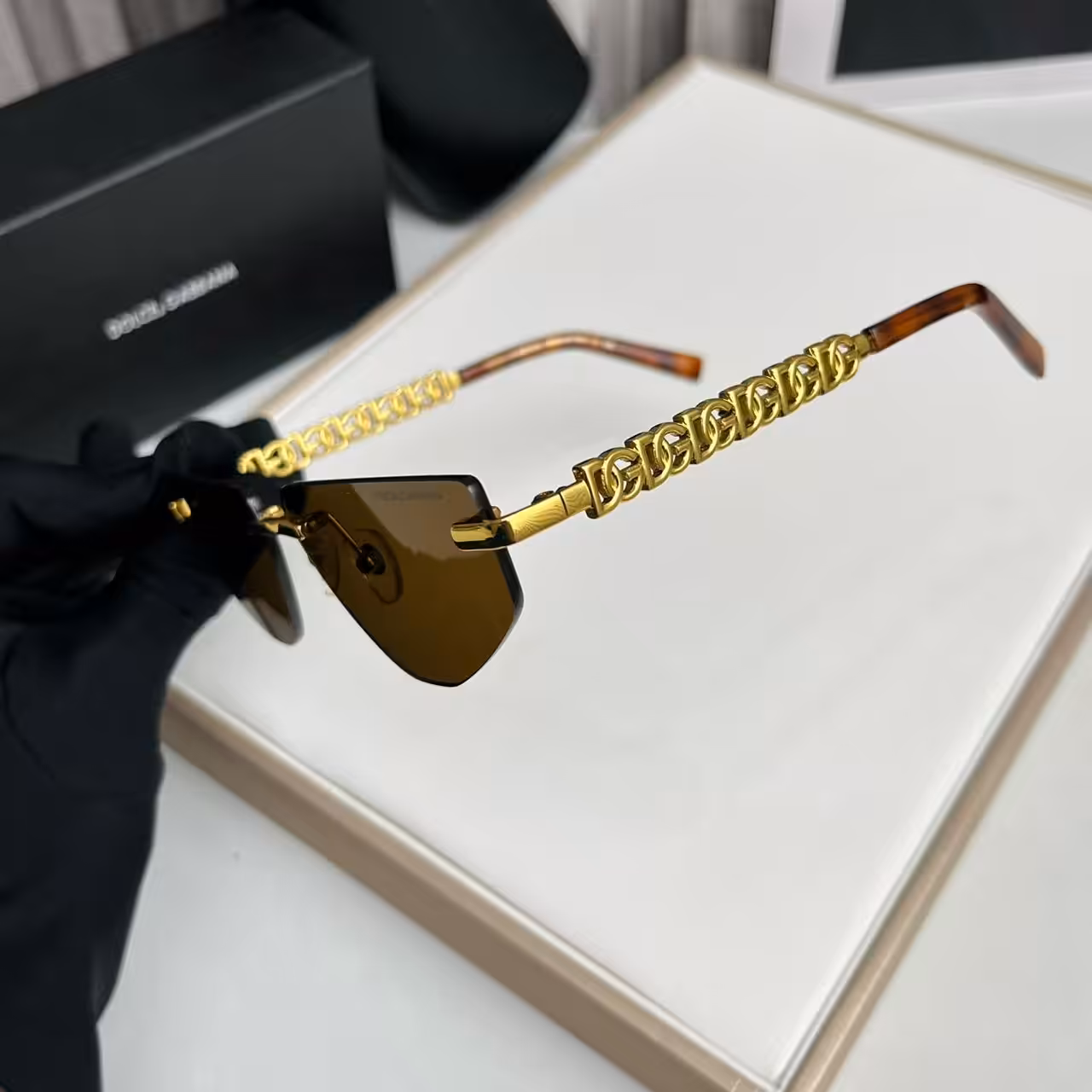 WhatsApp Image 2025-11-13 at 7.00.55 PM (2) Dolce & Gabbana Premium Gold Chain Brown Rimless Sunglasses